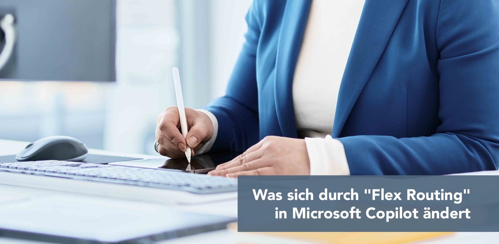 Professional in a blue blazer writes on a tablet with a stylus at a desk, with keyboard and mouse nearby; article banner in the lower right.