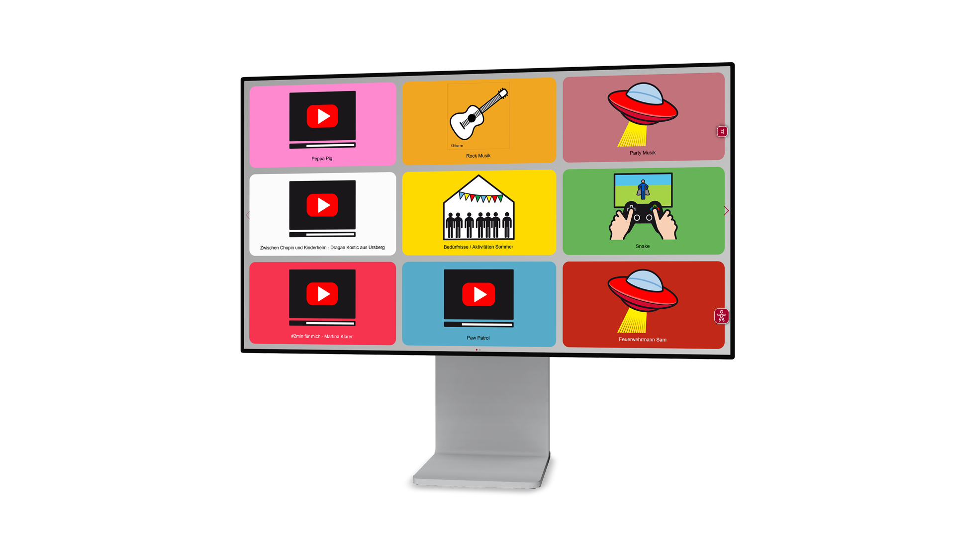 Screen shows a grid of nine colorful rounded tiles on a monitor, each with an icon and caption (e.g., YouTube play icon, guitar, UFO).
